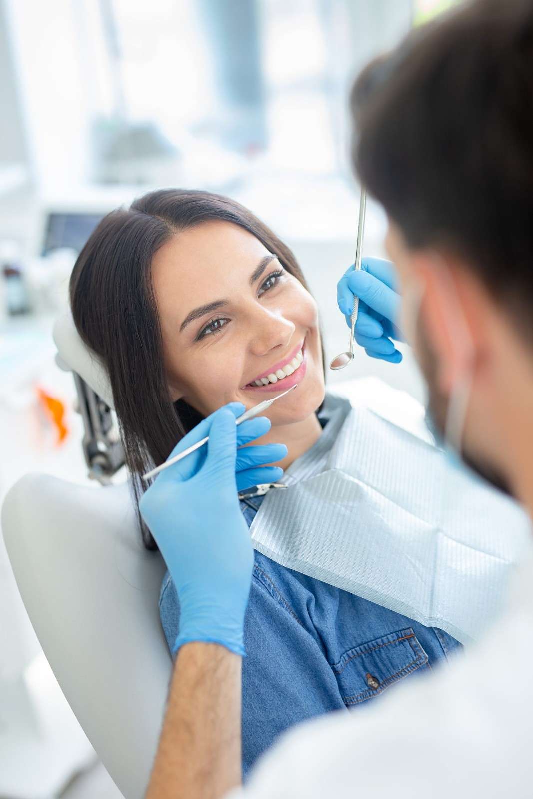 A dentist examining a patient