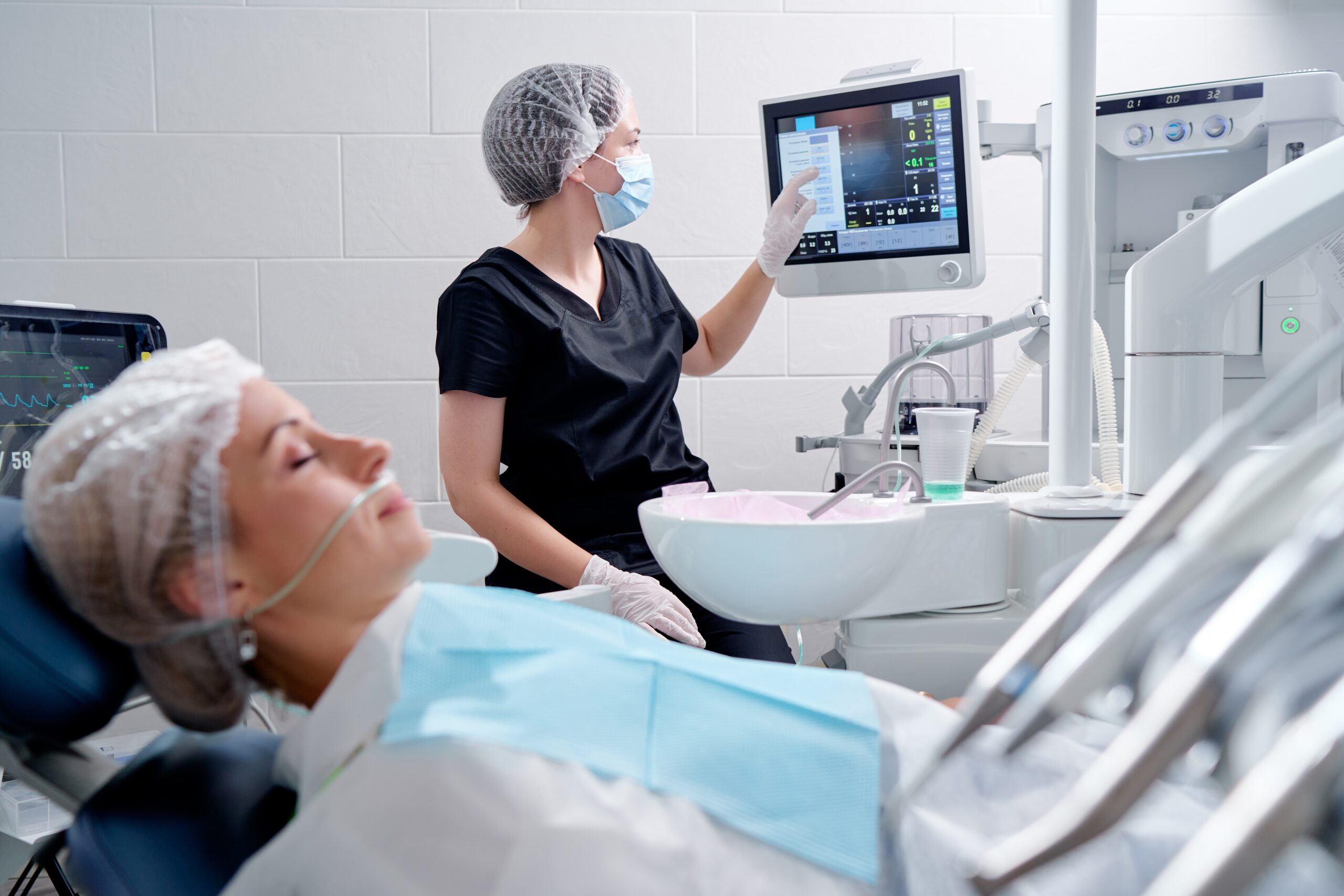 Dental team using advanced technology to treat patient during same-day dental emergency in Columbia MO